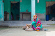 © IndiaPix - Indian woman grinding flour in grinding stone at her house in a village