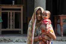 Portrait Of Mother And Her Child In Rural Village, India