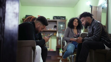 Candid group of friends staring at phones living in isolation bubbles