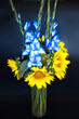 Bouquet of blue gladiolus and yellow sunflowers in the colors of the flag of Ukraine. Summer bouquet. Independence. A bouquet of flowers that symbolize the struggle. Vertical blue-yellow flowers.