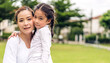 Portrait of enjoy happy love asian family mother and little asian girls child smiling and having fun hug with cute kid daughter moments good time