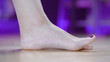 © Video_StockOrg - Female foot stretching toe exercise arch muscles close-up