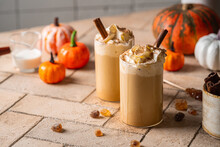 Autumn Pumpkin Spice Latte With Whipped Cream And Cinnamon On Light Background