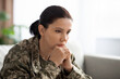 © Prostock-studio - Pensive Soldier Woman With PTSD Sitting On Couch And Looking Away