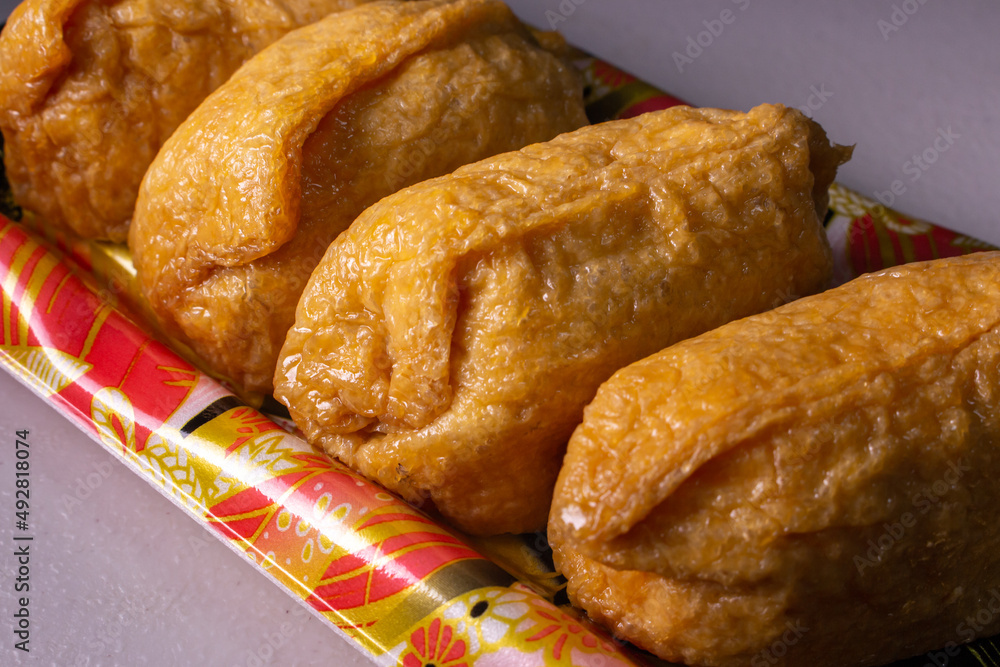 Closeup takeout Inarizushi (Inari sushi or fox sushi), a type of Sushi ...