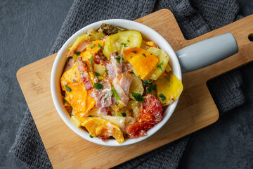 Wall Mural - Casserole of potato, sweet potato, zucchini, tomato and bacon