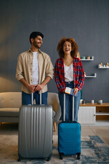 Sticker - Portrait of happy married couple with suitcases