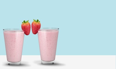 Wall Mural - Protein rich smoothies with yogurt and frozen strawberries in glass. Bright berry