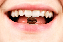 Coffee Bean In A Woman's Mouth, Close-up Of The Mouth. Coffee Addiction, Coffeemania