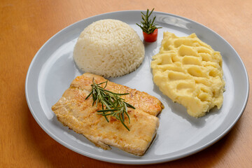 Wall Mural - Fish. Tilapia fillet with white rice and mashed potatoes. Set meal.