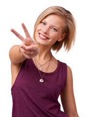 Wall Mural - All Im saying is.... Studio shot of happy young woman giving the peace sign to the camera isolated on white.