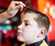 © Nikish H/peopleimages.com - Looking good. Closeup shot of a young boy getting a haircut at a barber shop.