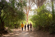 © Bruce and Rebecca Meissner/Stocksy - Family hike
