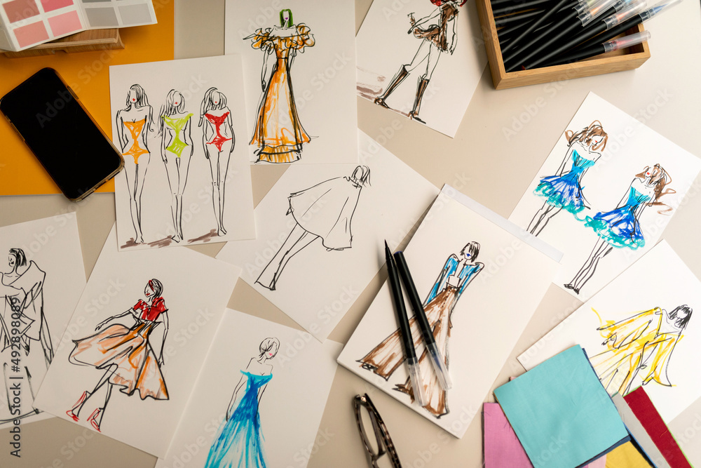 fashion drawings on desk top view Stock Photo | Adobe Stock