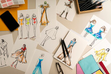 fashion drawings on desk  top view