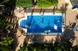 © Jose Coello/Stocksy - Summer in the swimming pool