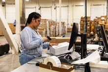  Worker Uses Digital Scanner At Ecommerce Warehouse 