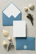 Wedding stationery set in marine style. Flat lay blue envelopes and wedding invitation card mockup