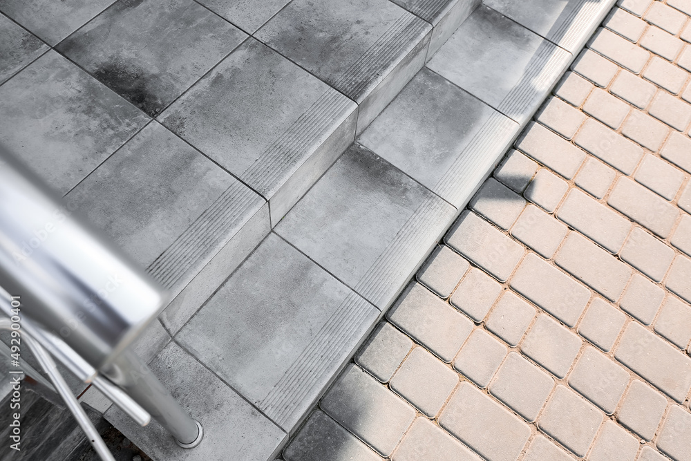 View of granite steps and pavement outdoors