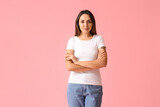 Fototapeta Panele - Young woman in blank t-shirt on color background