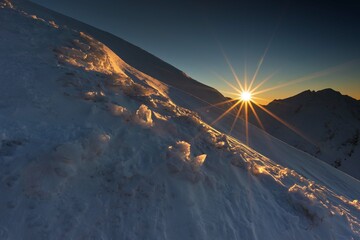 Wall Mural - beautiful winter views of the high tatra mountains with tourists, skiers and amazing states of natur