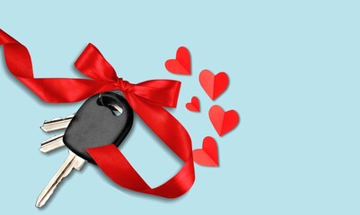 Wall Mural - Car key with a red bow and a heart. Giving present or gift for valentine day or christmas.