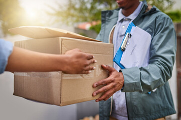 Poster - Delivered on time as promised. Closeup shot of an unrecognizable courier making a delivery to a customer.