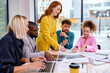 © Roman - Group of young business people having meeting in office, having talk, discuss, business team collaborating on project in office. in modern bright boadroom. business, successful cooperation