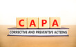 CAPA corrective and preventive actions symbol. Concept words CAPA corrective and preventive actions on cubes on a white background. Business CAPA corrective and preventive actions concept. Copy space.