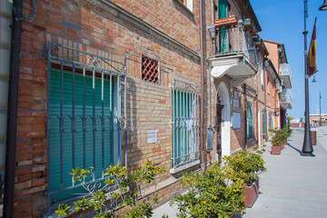 Canvas Print - Picturesque houses in the resort of Cervia in Italy by the Adriatic Sea 