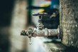 © Jordi - Drops of water from the old faucet,selective focus.