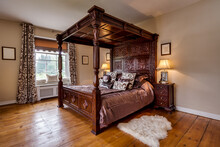 Victorian Rectory Bedroom With Ornate Carved Four Poster Bed