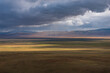 steppe mountains rain clouds sunlight sunset