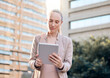 © Kay A/peopleimages.com - Time to end the day with some business. Shot of a young businesswoman using a digital tablet.