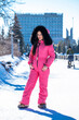 © Andrey_Arkusha - portrait of a young woman in a pink winter outfit with a fur hood