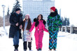 © Andrey_Arkusha - Young family of four walking outdoors in winter