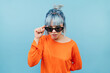 © bodnarphoto - Funny hipster girl with colored hair in sunglasses looks intently at the camera with a serious face.