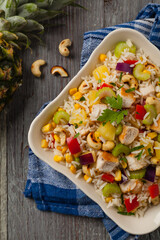 Wall Mural - Salad with rice, chicken, peanuts and vegetables. Top view.