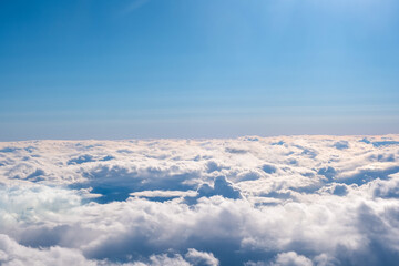 Wall Mural - aircraft wing view from airplane window seat. beautiful sky and cloud.