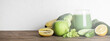 green smoothie in glass with vegetables on wooden and white background. vegan food and healthy lifestyle. detox diet. copy space. panoramic shot