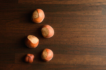 Wall Mural - hazelnut nuts healthy food on wood background,nutshell hazel 