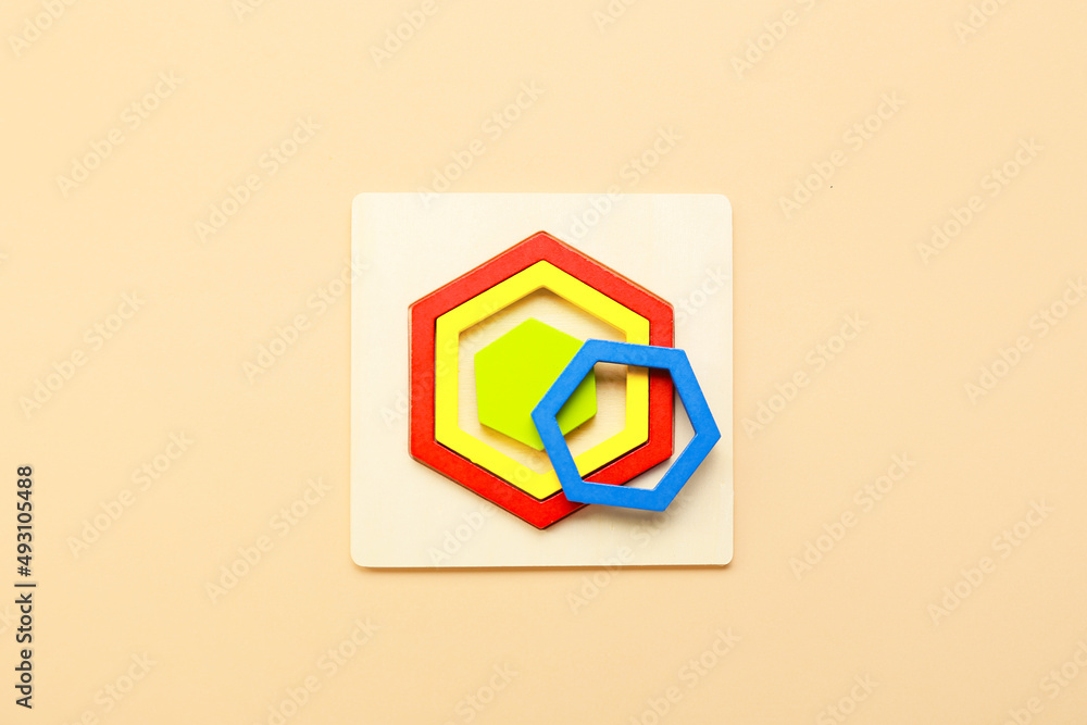 Children's toys on beige background. Concept of autistic disorder