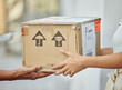 © Siphosethu F/peopleimages.com - Finally my parcel has arrived. Shot of a delivery man passing a package to a customer.