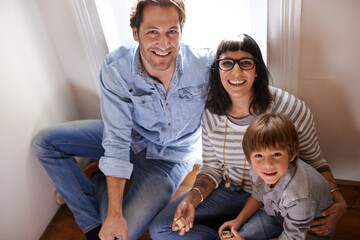 Sticker - Family bliss. A mother and father sitting with their son.