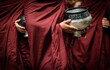 monks holding containers to wait for alms 