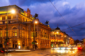 Wall Mural - Wide shot of traffic passing the Opernring and Vienna State Opera in Vienna, Austria