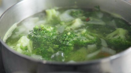 Wall Mural - Broccoli green cream soup. Vegan healthy food. Selective focus