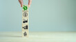 Carbon footprint. Green business concept. Climate changing problems solving goals. Stacking wooden cubes with carbon footprint icon on pollution source icons on grey background,copy space. Eco banner.