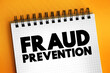 Fraud prevention - implementation of a strategy to detect fraudulent transactions and prevent these actions from causing financial damage, text concept on notepad