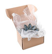 © New Africa - Ceramic decor item with bubble wrap in cardboard box isolated on white